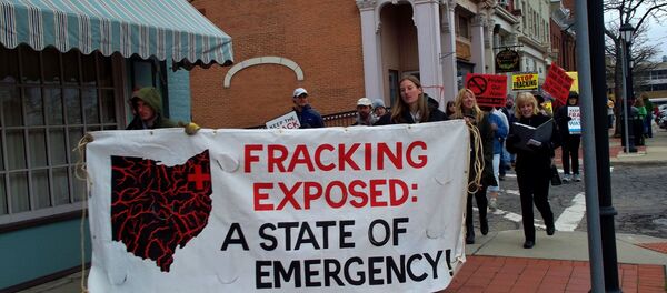 Ohio residents took to the streets to protest hydraulic fracturing, or fracking, the oil and gas drilling process expanding across the state, after a series of earthquakes were felt areas near fracking wells in March, 2014. - Sputnik International