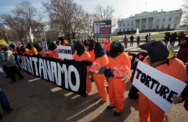 Protesters dressed as detainees gather in front of the White House on Sunday, during a rally to mark the 13th anniversary of the first detainees in the U.S.'s war on terror being brought to the detention center at Guantanamo Bay Naval Base in Cuba. Protesters dressed as detainees gather in front of the White House on Sunday, during a rally to mark the 13th anniversary of the first detainees in the U.S.'s war on terror being brought to the detention center at Guantanamo Bay Naval Base in Cuba. - Sputnik International