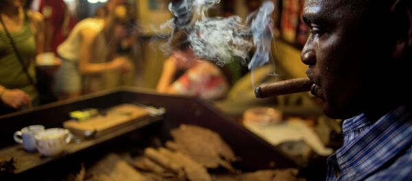 A worker rolls cigars during a demonstration for tourists at a cigar club shop in Havana, Cuba, Friday, Dec. 19, 2014. Cigars brought back to the U.S. must be for personal use, not resale - same as the rules that existed for travelers before August 2004, when the Bush administration imposed strict restrictions those traveling to the island. A worker rolls cigars during a demonstration for tourists at a cigar club shop in Havana, Cuba, Friday, Dec. 19, 2014. Cigars brought back to the U.S. must be for personal use, not resale - same as the rules that existed for travelers before August 2004, when the Bush administration imposed strict restrictions those traveling to the island. - Sputnik International