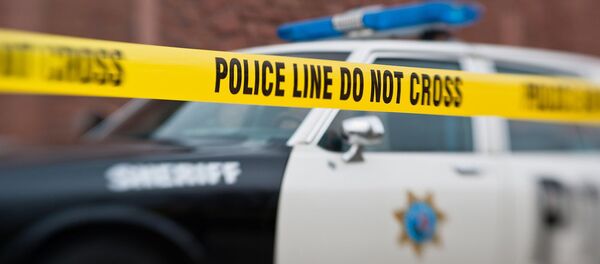 A police car behind a police do not cross line. A police car behind a police do not cross line. - Sputnik International