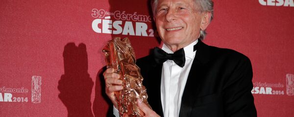 In this Feb. 28, 2014 file photo, Polish-French film director Roman Polanski holds his best director award during the 39th French Cesar Awards Ceremony in Paris. - Sputnik International