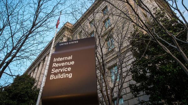 In this April 13, 2014 file photo, the Internal Revenue Service Headquarters (IRS) building is seen in Washington. The IRS is cutting taxpayer services to historically low levels just as President Barack Obama's health law will make filing a federal tax return more complicated for millions of families.  - Sputnik International