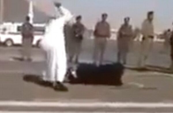 Screenshot of video leaked from Saudi Arabia showing the beheading of a woman accused of beating her daughter to death. Screenshot of video leaked from Saudi Arabia showing the beheading of a woman accused of beating her daughter to death. - Sputnik International