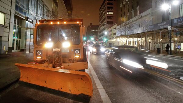 A New York City snowplow, loaded with salt, sits parked in midtown Manhattan as light snow falls, Monday, Jan. 26, 2015. Northeast residents are girding for a heavy snowstorm that could bury communities from northern New Jersey to southern Maine in up to 2 feet of snow. - Sputnik International