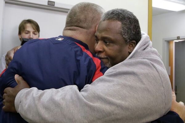 Alstory Simon, right, hugs supporter Shawn Rech, left, while leaving the Jacksonville Correction Center as a free man. Alstory Simon, right, hugs supporter Shawn Rech, left, while leaving the Jacksonville Correction Center as a free man. - Sputnik International
