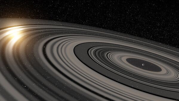 Artist's rendering of a “super Saturn” in a distant solar system recently found to have rings big enough to eclipse its own sun. - Sputnik International