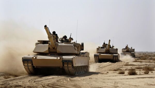 Iraqi Army M1 Abrams tanks, purchased from the U.S., maneuver during a live fire exercise outside Baghdad. - Sputnik International