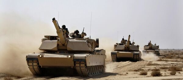 Iraqi Army M1 Abrams tanks, purchased from the U.S., maneuver during a live fire exercise outside Baghdad. Iraqi Army M1 Abrams tanks, purchased from the U.S., maneuver during a live fire exercise outside Baghdad. - Sputnik International