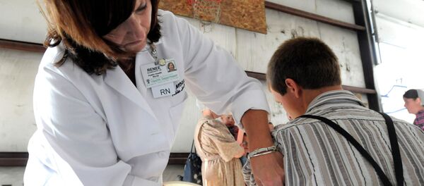 A health worker administers a measles vaccine in rural Ohio in 2014, where a measles outbreak of over 300 cases was the largest in the U.S. since 1994. - Sputnik International