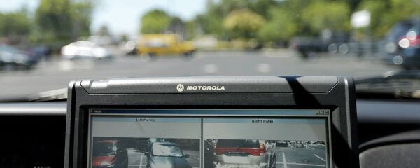 A Drug Enforcement Administration agent proposed using license-plate readers, such as this one, to track vehicles at gun shows. - Sputnik International