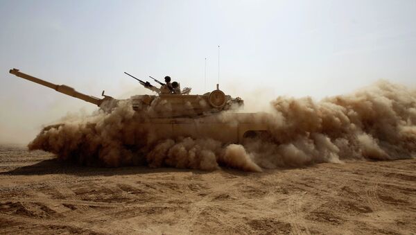 An Iraqi Army M1A1 Abrams tank, purchased from the U.S., maneuvers during a live fire exercise outside Baghdad, Iraq, Tuesday, Oct. 18, 2011. With the U.S. military scheduled to leave Iraq by the end of the year, the Iraqi security forces will be soley responsible for providing security for the country. - Sputnik International