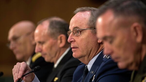 Air Force Chief of Staff Gen. Mark Welsh III, second from right, responds to questions from Senate Armed Services Committee member Sen. Kelly Ayotte, R-N.H., as he testifies on Capitol Hill in Washington, Wednesday, Jan. 28, 2015, before the committee's hearing on the impact of the Budget Control Act of 2011 and sequestration on national security. From left are, Army Chief of Staff Gen. Raymond Odierno, Chief of Naval Operations Adm. Jonathan Greenert, Welsh, and Marine Corps Commandant Joseph Dunford, Jr. - Sputnik International