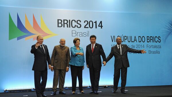 On July 15, 2014, BRICS leaders -- Russian President Vladimir Putin, Indian Prime Minister Narendra Modi, Brazilian President Dilma Rousseff, Chinese President Xi Jinping and South African President Jacob Zuma (from left to right) -- pose for a group photo in the Congress Center in Fortaleza. - Sputnik International