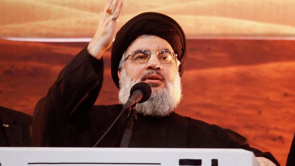 Lebanon's Hezbollah leader Sayyed Hassan Nasrallah addresses his supporters during a rare public appearance at an Ashoura ceremony in Beirut's southern suburbs November 3, 2014 - Sputnik International