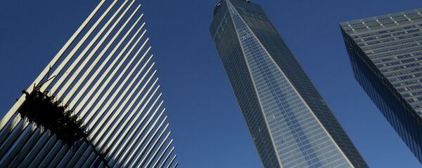 One World Trade Center stands between the transportation hub, left, still under construction, and 7 World Trade Center, right, Monday, Nov. 3, 2014 in New York One World Trade Center stands between the transportation hub, left, still under construction, and 7 World Trade Center, right, Monday, Nov. 3, 2014 in New York - Sputnik International