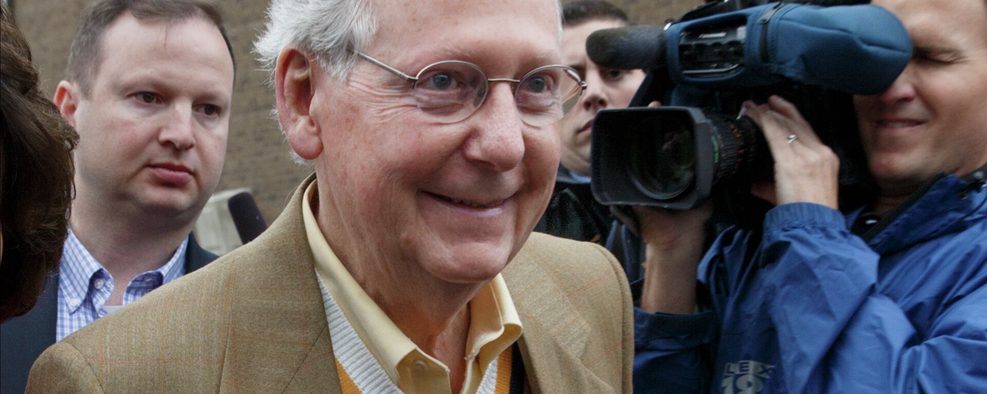 Senate Minority Leader Mitch McConnell, R-Ky., smiles after casting his ballot in the midterm election at the voting precinct at Bellarmine University in Louisville, Ky., Tuesday, Nov. 4, 2014 - Sputnik International, 1920, 15.10.2021