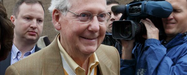 Senate Minority Leader Mitch McConnell, R-Ky., smiles after casting his ballot in the midterm election at the voting precinct at Bellarmine University in Louisville, Ky. - Sputnik International