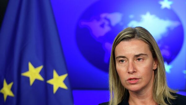 European Union foreign policy chief Federica Mogherini addresses a news conference after meeting NATO Secretary General Jens Stoltenberg (unseen) at the European External Action Service (EEAS) building in Brussels November 4, 2014 - Sputnik International