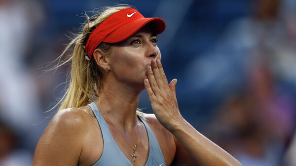 Maria Sharapova, of Russia, blows kisses to the crowd after defeating Alexandra Dulgheru, of Romania, during the second round of the 2014 U.S. Open tennis tournament, Wednesday, Aug. 27, 2014, in New York - Sputnik International