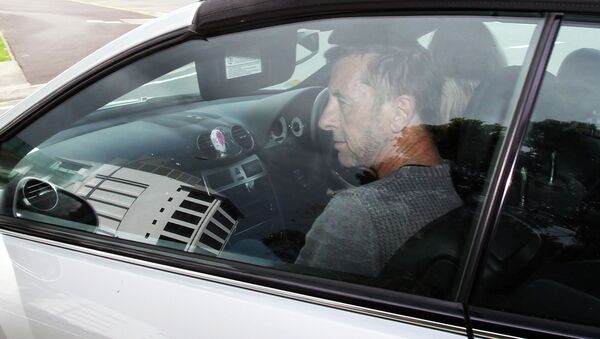 AC/DC drummer Phil Rudd leaves Tauranga District Court after being charged with attempting to procure murder at Tauranga District Court on November 6, 2014 in Tauranga, New Zealand - Sputnik International