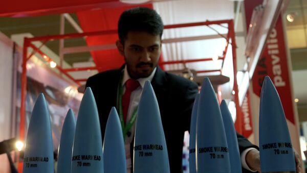 A Visitor inspects warheads on display during the opening day of Indo Defense Expo 2014 in Jakarta - Sputnik International