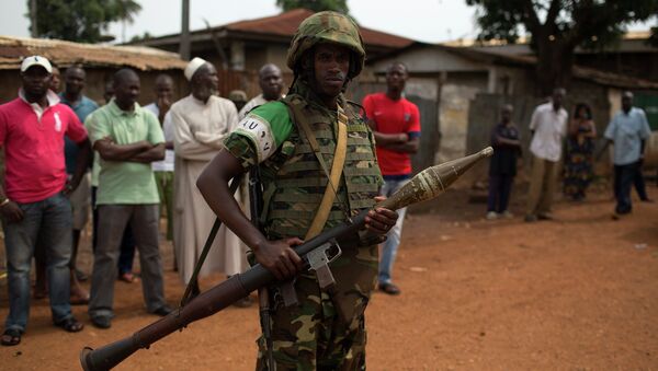 An African Union (AU) soldier stands guard outside a home in the Muslim neighbourhood of Kilometre 5 (PK5) in the capital Bangui - Sputnik International