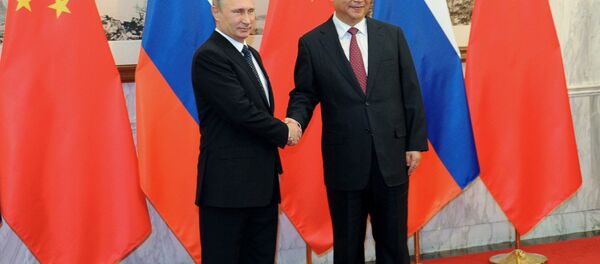 Russian President Vladimir Putin at the expanded meeting with Chinese President Xi Jinping, attended by the Russian and Chinese delegations, November 9, 2014. - Sputnik International