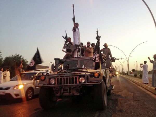 In this file photo taken Monday, June 23, 2014, fighters from the Islamic State group parade in a commandeered Iraqi security forces armored vehicle down a main road at the northern city of Mosul, Iraq. In this file photo taken Monday, June 23, 2014, fighters from the Islamic State group parade in a commandeered Iraqi security forces armored vehicle down a main road at the northern city of Mosul, Iraq. - Sputnik International