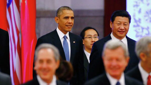 U.S. President Barack Obama (rear L) walks next to China's President Xi Jinping (rear R) as they arrive at a welcoming ceremony at the Great Hall of the People in Beijing, November 12, 2014 - Sputnik International