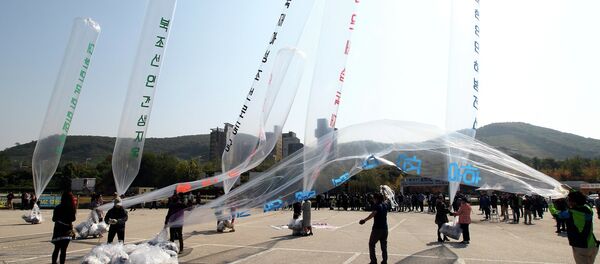 North Koran defectors prepare to release balloons carrying leaflets condemning North Korean leader Kim Jong Un and his government's policies North Koran defectors prepare to release balloons carrying leaflets condemning North Korean leader Kim Jong Un and his government's policies - Sputnik International
