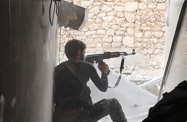 This undated photo posted on Monday, Nov. 4, 2014 by the Raqqa Media Office of the Islamic State group, a militant extremist group, shows an Islamic state group fighter in Kobani, Syria This undated photo posted on Monday, Nov. 4, 2014 by the Raqqa Media Office of the Islamic State group, a militant extremist group, shows an Islamic state group fighter in Kobani, Syria - Sputnik International