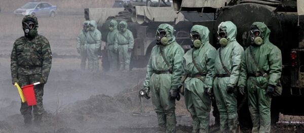 Servicemen of a radioactive and chemical protection unit during an inter-agency training exercise Servicemen of a radioactive and chemical protection unit during an inter-agency training exercise - Sputnik International