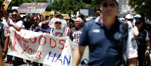 Australian Aboriginal rights activists burned the Australian flag protesting against Prime Minister Tony Abbott's view on Australian history. Earlier this week, during an international business breakfast, Abbott said that before the British colonization Australia was nothing but bush. Australian Aboriginal rights activists burned the Australian flag protesting against Prime Minister Tony Abbott's view on Australian history. Earlier this week, during an international business breakfast, Abbott said that before the British colonization Australia was nothing but bush. - Sputnik International