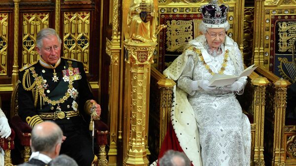 File photo of Britain's Queen Elizabeth as delivers her speech during the State Opening of Parliament at the House of Lords, alongside Prince Charles in London - Sputnik International