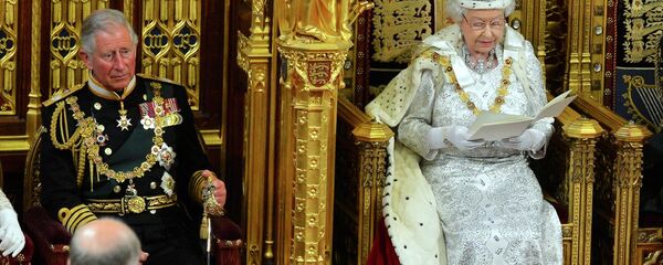 File photo of Britain's Queen Elizabeth as delivers her speech during the State Opening of Parliament at the House of Lords, alongside Prince Charles in London File photo of Britain's Queen Elizabeth as delivers her speech during the State Opening of Parliament at the House of Lords, alongside Prince Charles in London - Sputnik International