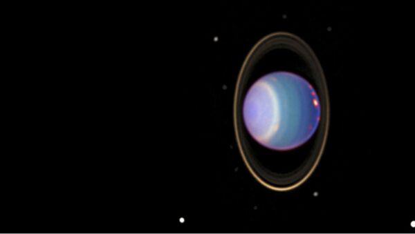 A recent Hubble Space Telescope (HST) view reveals Uranus surrounded by its 4 major rings and 10 of its 17 known satellites - Sputnik International