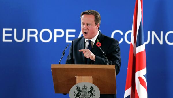 British Prime Minister David Cameron speaks during a media conference after an EU summit at the EU Council building in Brussels, on Friday, Oct. 24, 2014 - Sputnik International