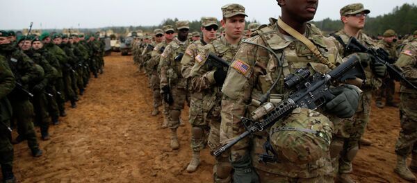 Members of the U.S. Army B Company, 2nd Battalion, 8th Cavalry Regiment, 1st Brigade Combat Team, 1st Cavalry Division attend a military exercise 'Iron Sword 2014', at the Gaiziunu Training Range in Pabrade some 60km.(38 miles) north of the capital Vilnius, Lithuania, Thursday, Nov.13, 2014 Members of the U.S. Army B Company, 2nd Battalion, 8th Cavalry Regiment, 1st Brigade Combat Team, 1st Cavalry Division attend a military exercise 'Iron Sword 2014', at the Gaiziunu Training Range in Pabrade some 60km.(38 miles) north of the capital Vilnius, Lithuania, Thursday, Nov.13, 2014 - Sputnik International