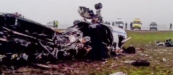 In this image made from video provided by Russian State Television Rossiya, investigators works at the wreckage of a private jet which collided with a snowplow at Vnukovo airport in Moscow, Tuesday, Oct. 21, 2014 In this image made from video provided by Russian State Television Rossiya, investigators works at the wreckage of a private jet which collided with a snowplow at Vnukovo airport in Moscow, Tuesday, Oct. 21, 2014 - Sputnik International