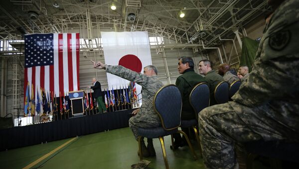 Lt. Gen. Salvatore Angelella, center bottom, the Commander, U.S. Forces Japan, gestures as U.S. Secretary of Defense Chuck Hagel, back left, listens to questions from the U.S. military personnel upon his arrival at the U.S. Yokota Air Base on the outskirts of Tokyo, Saturday, April 5, 2014. - Sputnik International