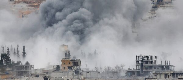 Smoke rises from the Syrian city of Kobani - Sputnik International