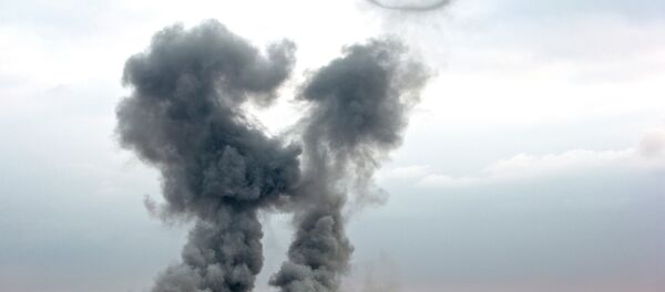 Smoke rises from the Syrian city of Kobani Smoke rises from the Syrian city of Kobani - Sputnik International