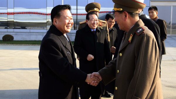 North Korean leader Kim Jong-un's special envoy Choe Ryong Hae (left) and his delegation members leave the Pyongyang Airport  for Russia Monday, November 17, 2014. - Sputnik International