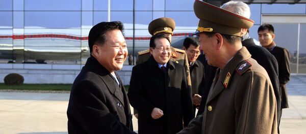 North Korean leader Kim Jong-un's special envoy Choe Ryong Hae (left) and his delegation members leave the Pyongyang Airport for Russia Monday, November 17, 2014. North Korean leader Kim Jong-un's special envoy Choe Ryong Hae (left) and his delegation members leave the Pyongyang Airport for Russia Monday, November 17, 2014. - Sputnik International