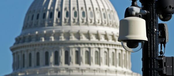 Surveillance cameras are visible near the U.S.Capitol in Washington Saturday, Oct. 26, 2013 - Sputnik International