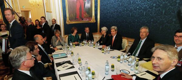 French Foreign Minister Laurent Fabius, sitting third left, former EU foreign policy chief Catherine Ashton, rear center, U.S. Secretary of State John Kerry, fourth right, and British Foreign Secretary Philip Hammond wait for the start of closed-door nuclear talks on Iran in Vienna, Austria, Friday, Nov. 21, 2014 French Foreign Minister Laurent Fabius, sitting third left, former EU foreign policy chief Catherine Ashton, rear center, U.S. Secretary of State John Kerry, fourth right, and British Foreign Secretary Philip Hammond wait for the start of closed-door nuclear talks on Iran in Vienna, Austria, Friday, Nov. 21, 2014 - Sputnik International