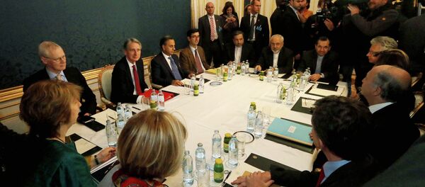 Former EU foreign policy chief Catherine Ashton, left, British Foreign Secretary Philip Hammond, third left, Iranian Foreign Minister Mohammad Javad Zarif, rear center, and French Foreign Minister Laurent Fabius, second right, wait for the start of closed-door nuclear talks with Iran. Former EU foreign policy chief Catherine Ashton, left, British Foreign Secretary Philip Hammond, third left, Iranian Foreign Minister Mohammad Javad Zarif, rear center, and French Foreign Minister Laurent Fabius, second right, wait for the start of closed-door nuclear talks with Iran. - Sputnik International