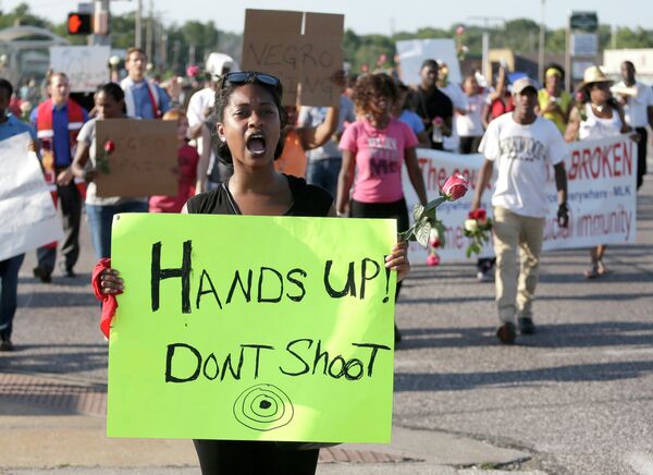 Protesters march Tuesday for Michael Brown, who was killed by police in Ferguson Protesters march Tuesday for Michael Brown, who was killed by police in Ferguson - Sputnik International