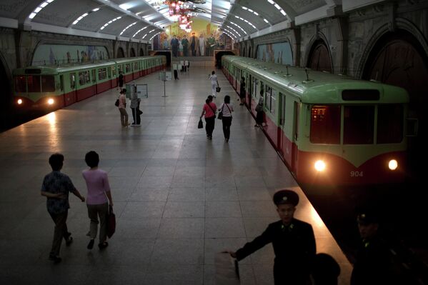 Commuters walk inside Puhung subway station, or prosperity station, in Pyongyang, North Korea - Sputnik International