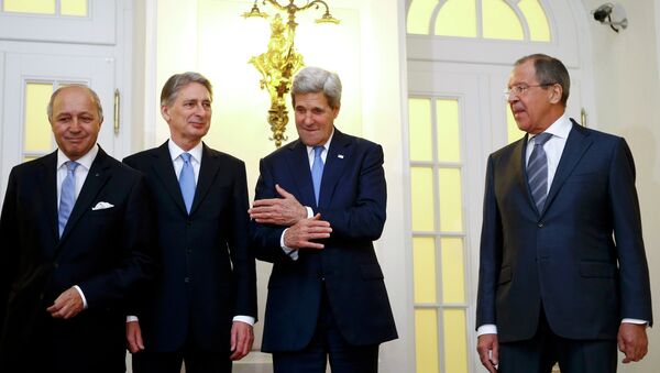 French Foreign Minister Laurent Fabius, Britain's Foreign Secretary Philip Hammond, U.S. Secretary of State John Kerry and Russian Foreign Minister Sergei Lavrov (LtoR) pose for photographers before a meeting in Vienna - Sputnik International
